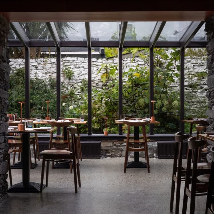 The warm stone dining room at Baba'de